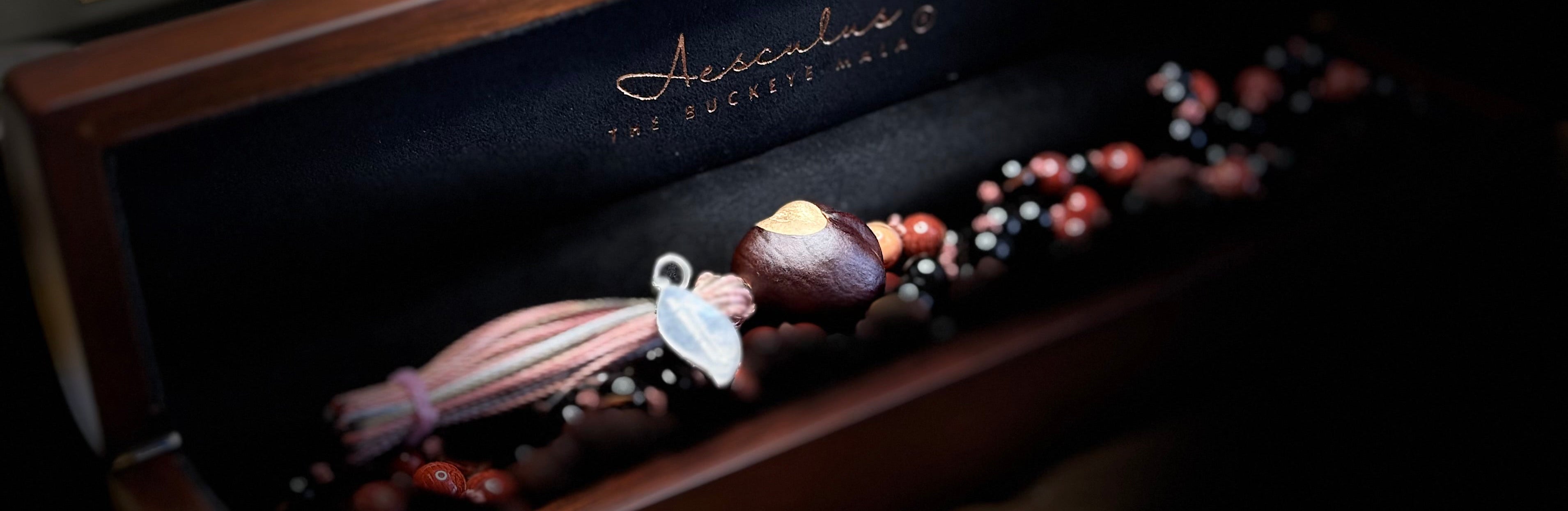 Wooden jewelry box with jewelry inside on a dark background